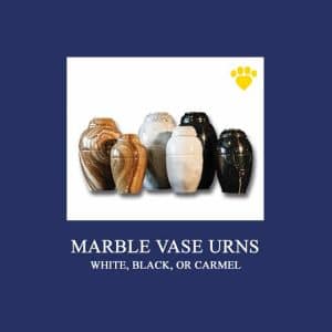 A collection of marble vase urns in different colors, including white, black, and caramel, are displayed against a deep blue background. The text below the image reads "MARBLE VASE URNS WHITE, BLACK, OR CARMEL." A small yellow paw print in the top right corner hints at a vet's compassionate touch.