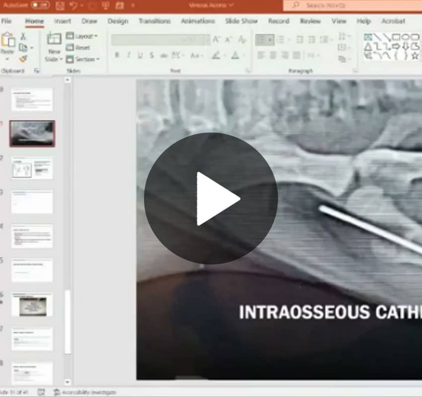 A computer screen displays a PowerPoint slide with the title "INTRAOSSEOUS CATH" alongside an X-ray image showing an intraosseous catheter, essential for veterinary procedures. The slide navigation pane is visible on the left, and playback controls are centered over the presentation.